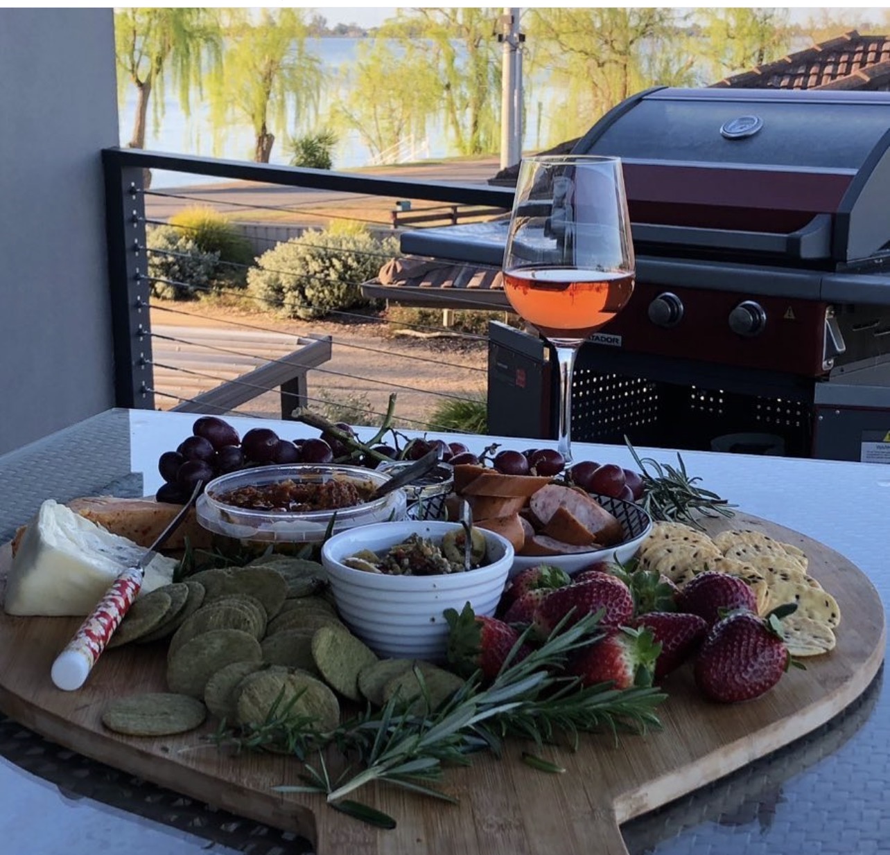 Grazing platter and wine on the balcony with lake views